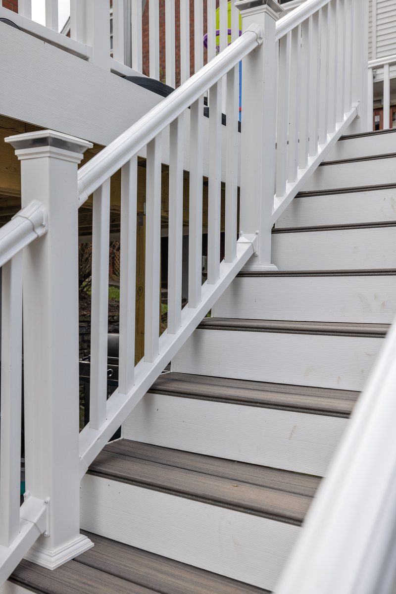 Composite deck stairs with white railing