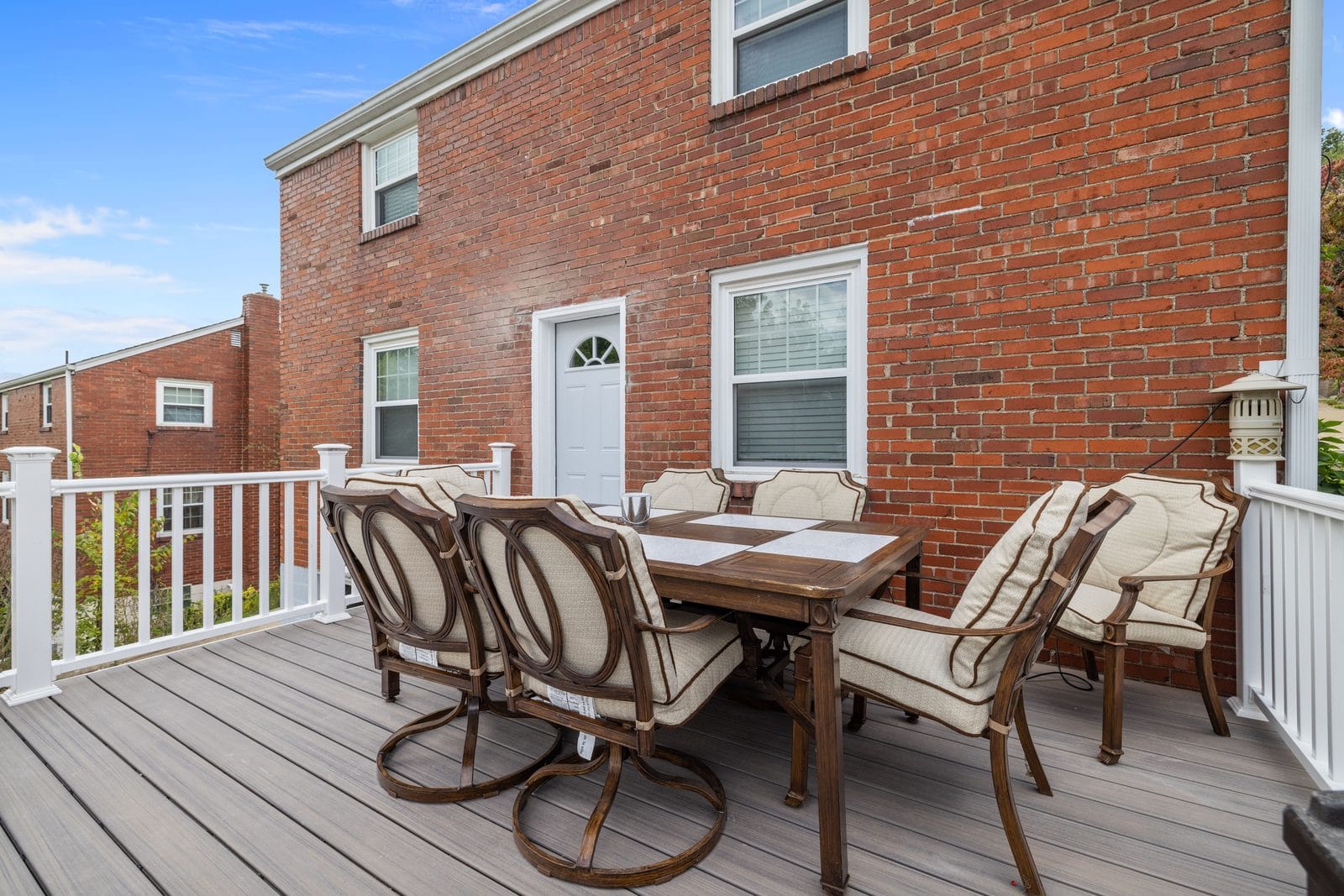 Townhouse deck with white railing in Pittsburgh