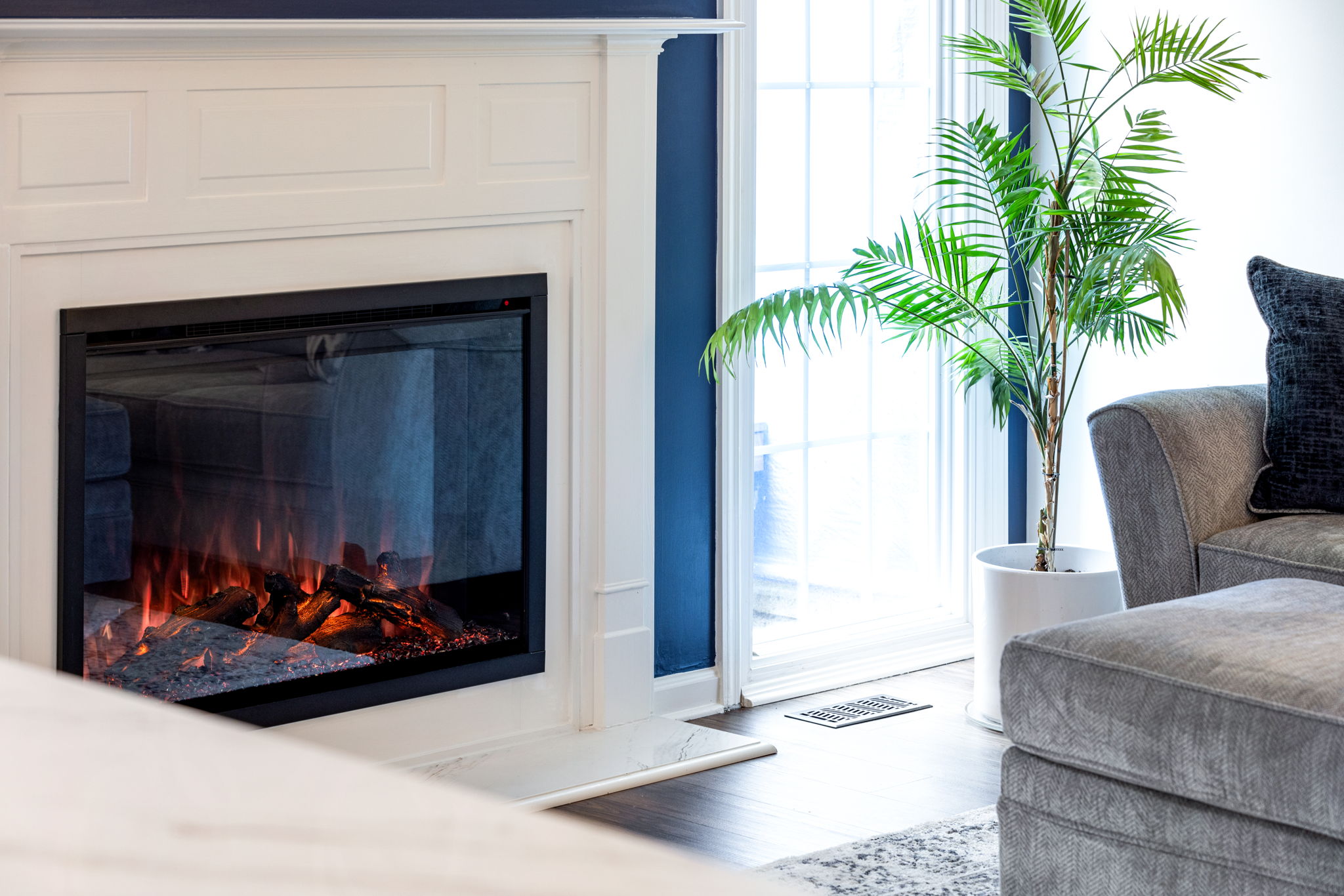 Electric fireplace with white mantle surround
