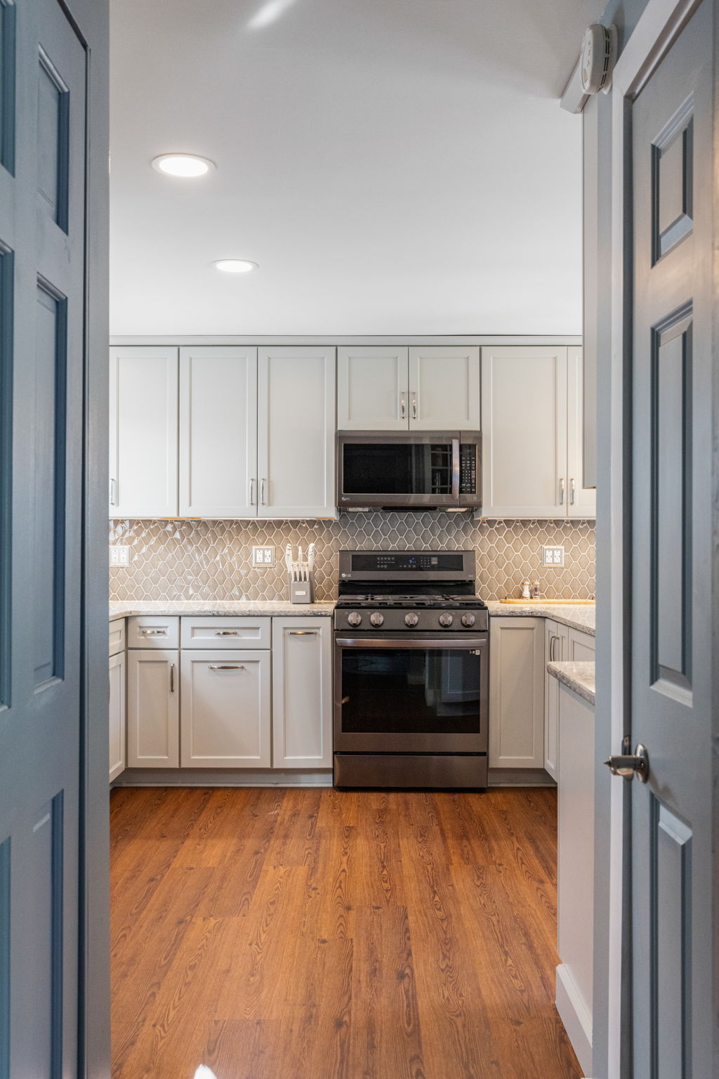 Gray kitchen with arabesque backsplash detail