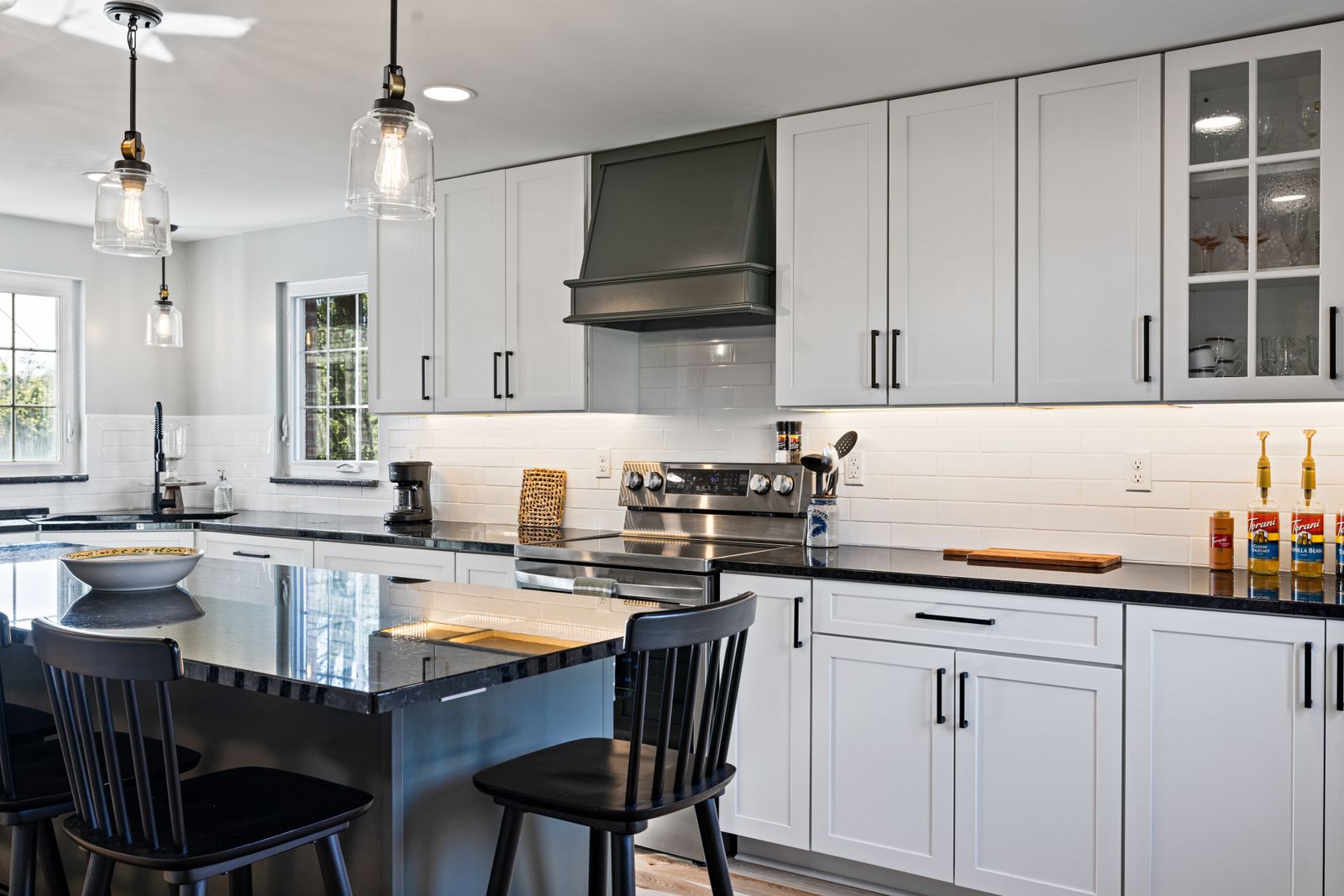 Kitchen island with pendant lighting and quartz countertop