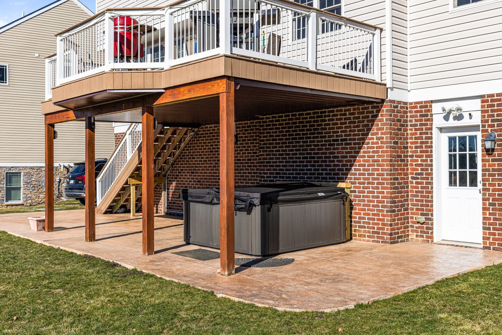 Covered patio with hot tub installation in Pittsburgh
