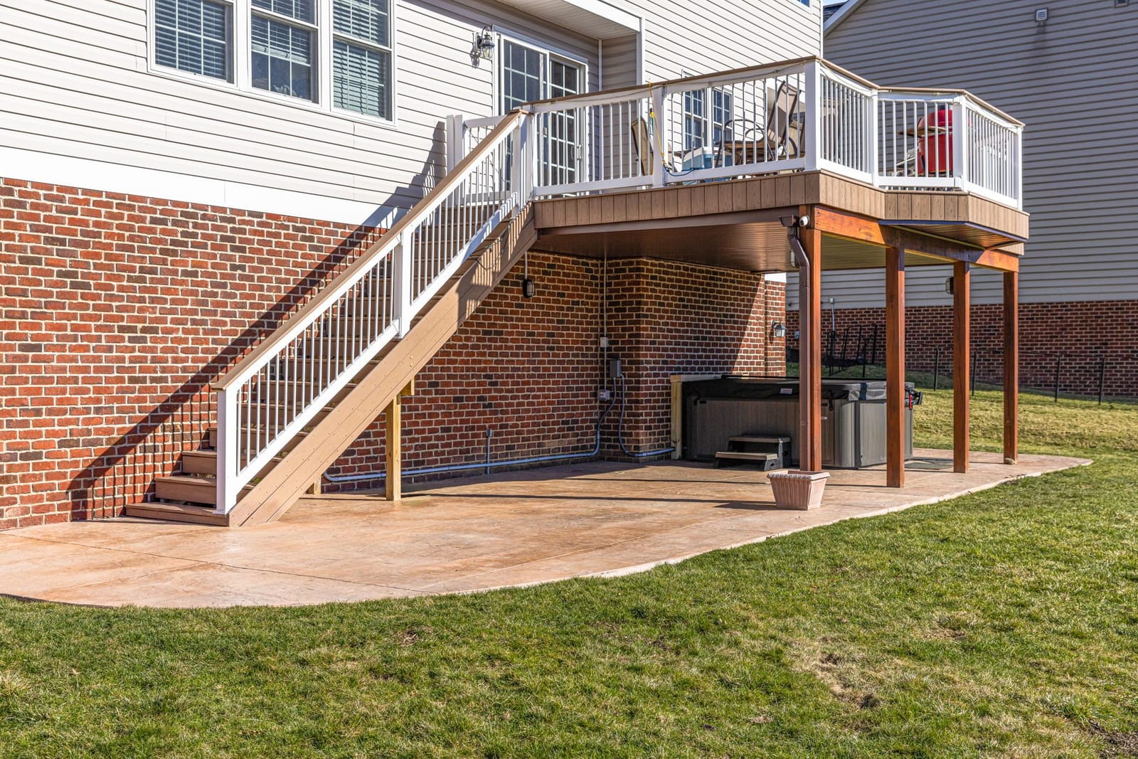 Stamped concrete patio with deck and pergola in Pittsburgh