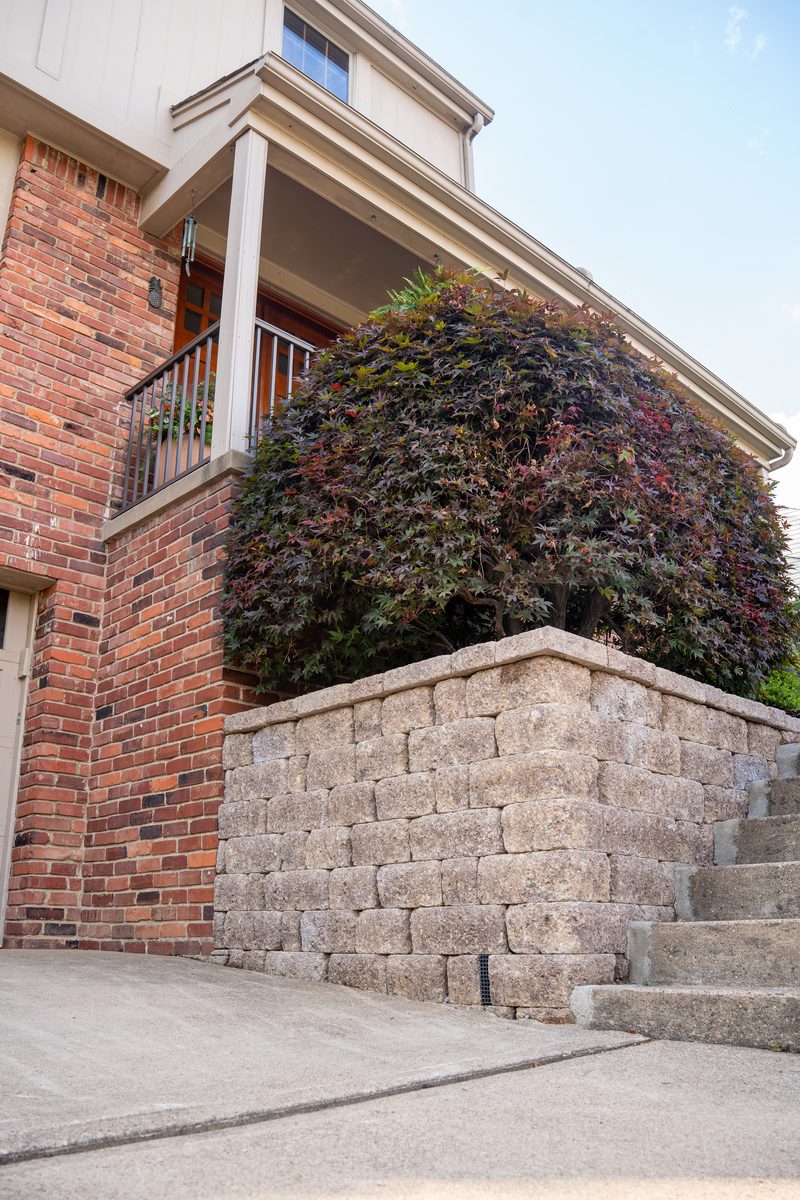Completed stone wall with landscaping